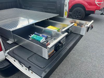 Low-profile truck bed toolbox Low-profile truck bed toolbox